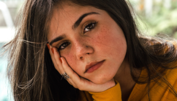 A woman thinking about telling her family she's pregnant