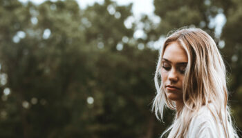 A young woman thinking about pregnancy symptoms